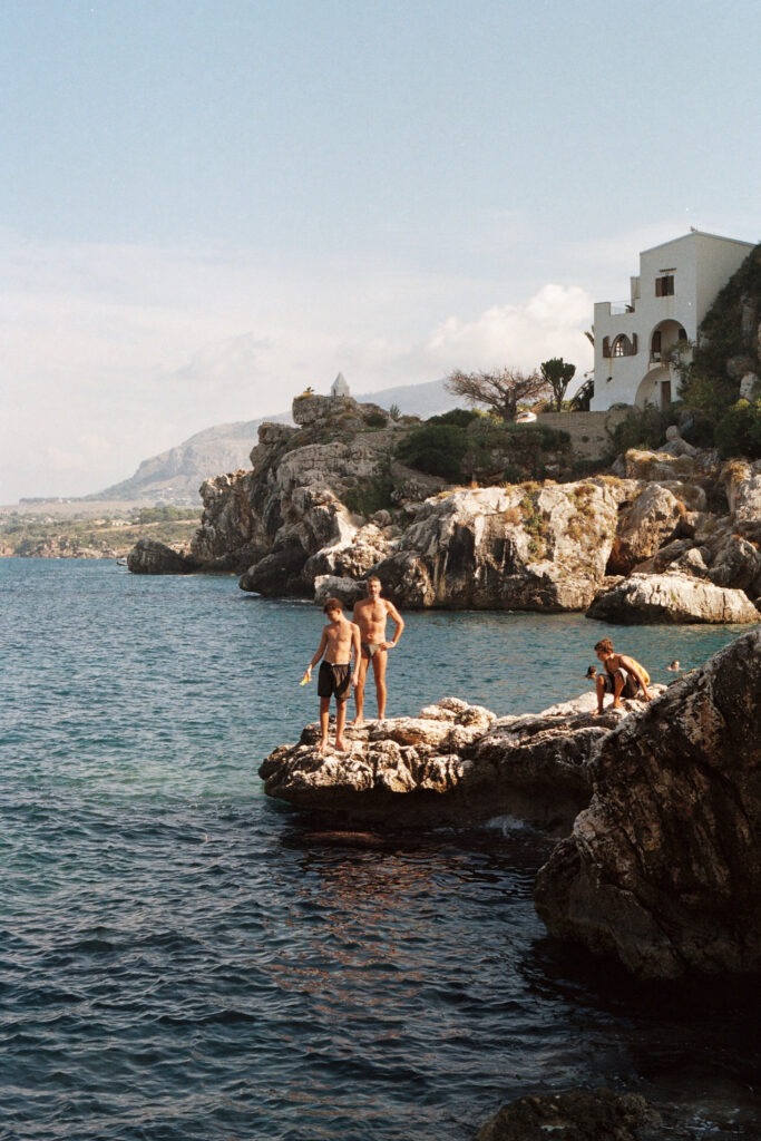 Houses built on the cliffs of Tonnara di Scopello overlooking the sea