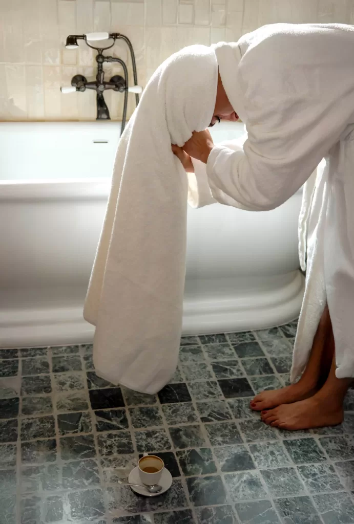 Guest moment in a design-led boutique hotel bathroom